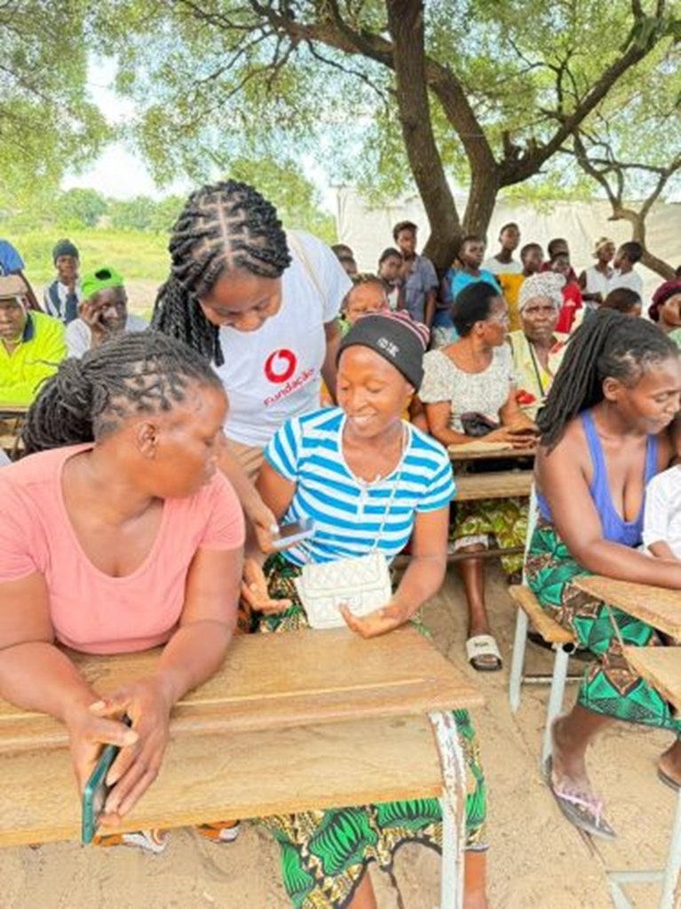 Female volunteer with community in Mozambique